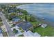 Aerial view of lakefront homes with docks and beautiful waterfront scenery and lush green yards at 331 Bay St, Auburndale, FL 33823