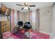 Bedroom with ceiling fan, TV and message on the wall at 331 Bay St, Auburndale, FL 33823