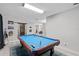 Spacious game room featuring a pool table with blue felt, and light wood-look floors at 331 Bay St, Auburndale, FL 33823