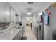 Modern kitchen featuring gray cabinets, marble countertops, and stainless steel appliances at 331 Bay St, Auburndale, FL 33823