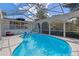 Refreshing screened-in pool area, perfect for relaxing and entertaining outdoors at 331 Bay St, Auburndale, FL 33823