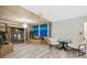 Unique sitting room with stone-like walls, white chairs, and a tranquil fountain feature at 331 Bay St, Auburndale, FL 33823