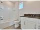 Cozy bathroom with white cabinets, granite countertops, tub, and shower combo at 3431 Islewood Ct, Ocoee, FL 34761