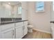 Modern bathroom featuring granite countertops and tile flooring at 3431 Islewood Ct, Ocoee, FL 34761