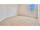 A carpeted bedroom with a window and neutral paint at 3431 Islewood Ct, Ocoee, FL 34761