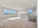 Bright bonus room with three large windows and neutral carpeting at 3431 Islewood Ct, Ocoee, FL 34761