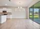 Bright dining area with sliding glass doors and access to the kitchen at 3431 Islewood Ct, Ocoee, FL 34761