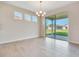 Dining room showcasing sliding glass doors and stylish chandelier at 3431 Islewood Ct, Ocoee, FL 34761