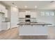 Kitchen island featuring granite counters, stainless steel sink, and pendant lights at 3431 Islewood Ct, Ocoee, FL 34761