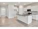 Kitchen featuring granite counters, an island, and stainless appliances at 3431 Islewood Ct, Ocoee, FL 34761