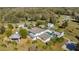 Majestic aerial view of the home and grounds, highlighting the surrounding trees and peaceful setting at 34500 Tree Frog Ln, Eustis, FL 32736