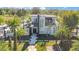 Aerial view of a modern two-story house surrounded by palm trees at 34500 Tree Frog Ln, Eustis, FL 32736