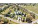 Sprawling aerial view of the property, boasting a refreshing pool, a luxurious home, and pristine landscaping at 34500 Tree Frog Ln, Eustis, FL 32736