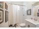 Bright bathroom featuring a shower, toilet, and vanity, ideal for guests at 34500 Tree Frog Ln, Eustis, FL 32736