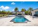 Modern pool with a separate spa and cabana with an outdoor kitchen at 34500 Tree Frog Ln, Eustis, FL 32736