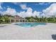 A community pool with a red roof pavilion, providing residents with a resort-style amenity and relaxation space at 3476 Sandalwood Isle Way, Ocoee, FL 34761