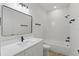 Clean bathroom with a white vanity, black fixtures, and a bathtub-shower combination at 355 Anderson Dr, Groveland, FL 34736