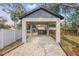 This home has an outdoor covered parking carport with gravel leading up to it at 355 Anderson Dr, Groveland, FL 34736