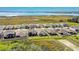 Aerial view of a community with modern homes, green spaces, and proximity to a serene lake at 362 Sofia Ln, Lake Alfred, FL 33850