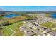 Aerial view of a community with modern homes, green spaces, and proximity to a serene lake at 362 Sofia Ln, Lake Alfred, FL 33850