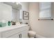 Well-lit bathroom featuring a vanity with a sink and cabinets, toilet, and a shower-tub combo at 362 Sofia Ln, Lake Alfred, FL 33850