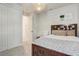 Bedroom with a dark wood bed frame, soft rug, and light walls with decor at 362 Sofia Ln, Lake Alfred, FL 33850