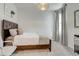 Cozy bedroom featuring plush carpeting, a comfortable bed, soft natural lighting, and neutral tones at 362 Sofia Ln, Lake Alfred, FL 33850