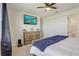 Bedroom featuring a spacious layout with a cozy bed, modern television, and a matching dresser at 362 Sofia Ln, Lake Alfred, FL 33850