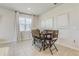 Dining area featuring tile floors, a wooden table, and bright natural light at 362 Sofia Ln, Lake Alfred, FL 33850