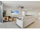 Bright living room with a ceiling fan, tile flooring, and a modern coastal style at 362 Sofia Ln, Lake Alfred, FL 33850