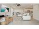 Open-concept living area featuring tile floors and a harmonious flow into the kitchen space at 362 Sofia Ln, Lake Alfred, FL 33850