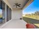 Covered patio with fan and sliding door access to backyard at 362 Sofia Ln, Lake Alfred, FL 33850