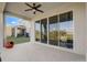 Covered patio with fan, next to sliding glass doors, offering seamless indoor-outdoor living at 362 Sofia Ln, Lake Alfred, FL 33850