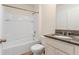 Cozy bathroom featuring a granite countertop, tile flooring, and a shower-tub combination at 3762 Sungrove Cir, Sanford, FL 32771