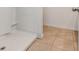 Bathroom showing tiled floor, corner of shower and door knob at 3762 Sungrove Cir, Sanford, FL 32771