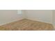 Minimalist bedroom with neutral carpet and white walls, offering a serene space at 3762 Sungrove Cir, Sanford, FL 32771