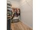 Well-organized closet featuring shelving, hanging space, and storage for clothes and shoes at 3762 Sungrove Cir, Sanford, FL 32771