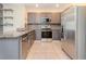 Modern kitchen featuring gray cabinets, stainless steel appliances, and stylish backsplash at 3762 Sungrove Cir, Sanford, FL 32771