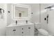 Bright bathroom featuring a double-sink vanity and shower with vertical subway tiles at 4087 Clock Tower Dr, Port Orange, FL 32129