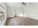 Bedroom featuring a large window, wood floors and white walls at 4087 Clock Tower Dr, Port Orange, FL 32129