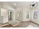 Bright living room featuring hardwood floors, recessed lighting, and a modern chandelier at 4087 Clock Tower Dr, Port Orange, FL 32129