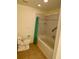 Bathroom featuring tan-colored tile flooring with a toilet, and bathtub at 435 Pleasant St, Lake Helen, FL 32744