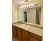 Bathroom with tile flooring, light counter tops, and a large mirror at 435 Pleasant St, Lake Helen, FL 32744