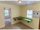 Bedroom featuring a green built in desk with natural light and a ceiling light at 435 Pleasant St, Lake Helen, FL 32744