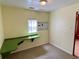 Bedroom featuring a green built in desk with natural light, and a ceiling light at 435 Pleasant St, Lake Helen, FL 32744