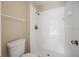 Bathroom with toilet and white tiled shower stall and bronze fixtures at 483 Green Spring Cir, Winter Springs, FL 32708