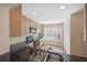 Bright kitchen features wooden cabinetry, black appliances, and a window for natural light at 483 Green Spring Cir, Winter Springs, FL 32708