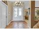 Elegant foyer with tile flooring and natural light beaming from the front doors at 490 Wekiva Preserve Dr, Apopka, FL 32712