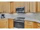 Close-up of the oven in the kitchen, plus modern cabinets and subway tile backsplash at 490 Wekiva Preserve Dr, Apopka, FL 32712