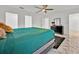 Bright bedroom with a ceiling fan, stylish decor, and a comfortable bed for a relaxing retreat at 5108 Avignon Ct, Orlando, FL 32839